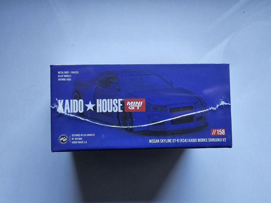 Mini GT Kaido House Nissan Skyline GT-R R34 autko model 1:64 shinjuku