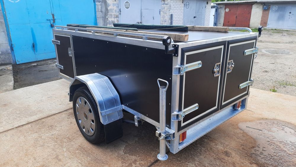 Прицеп , причіп для перевозки собак.