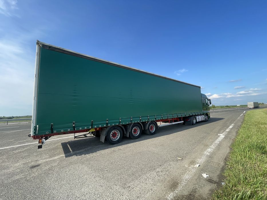 Тягач Man TGX 18.440 MEGA + напівпричіп штора Kassbohrer осі SAF