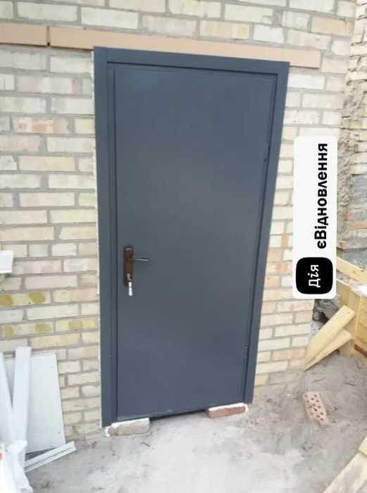 Двері вхідні технічні металеві тамбурні з ДСП накладками
