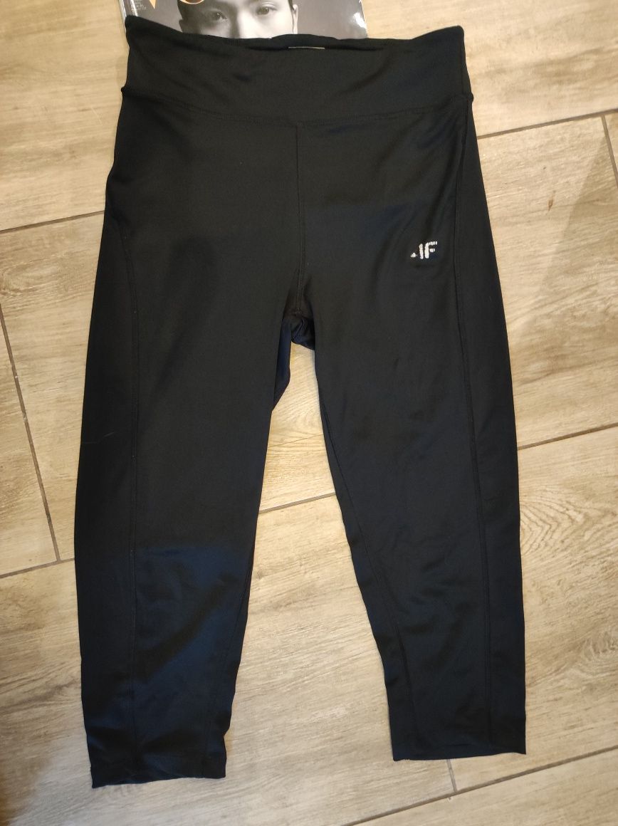 Legginsy 3/4 marki 4F. Długie kolarki sportowe.