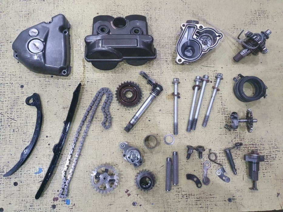 Silnik Suzuki RMZ/KXF 250  części 4T 06r pokrywy króciec mech. kopki