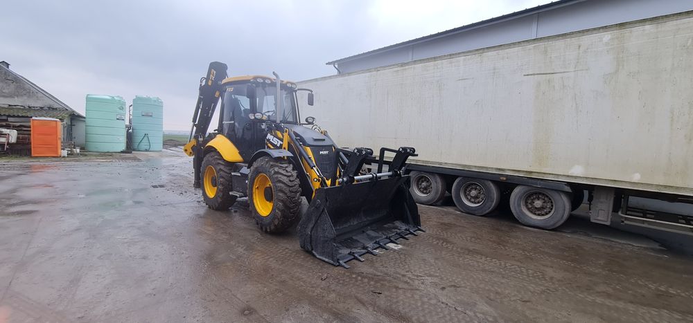 Usługi nową koparko ładowarką , niwelacja terenu, szambo, oczyszczalni