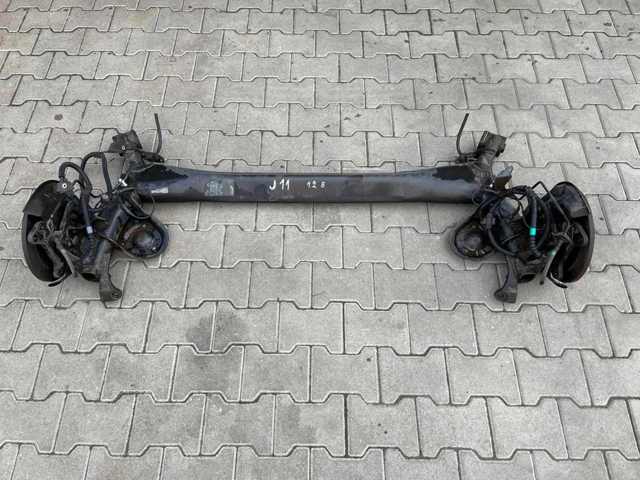 NISSAN QASHQAI II J11 1.2 DIG-T BELKA OŚ ZAWIESZENIE TYŁ