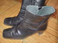 Botas com salto alto