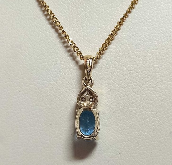 Wisiorek, przywieszka z topazem blu i diamentami, złoto 9K, poł. XX w.