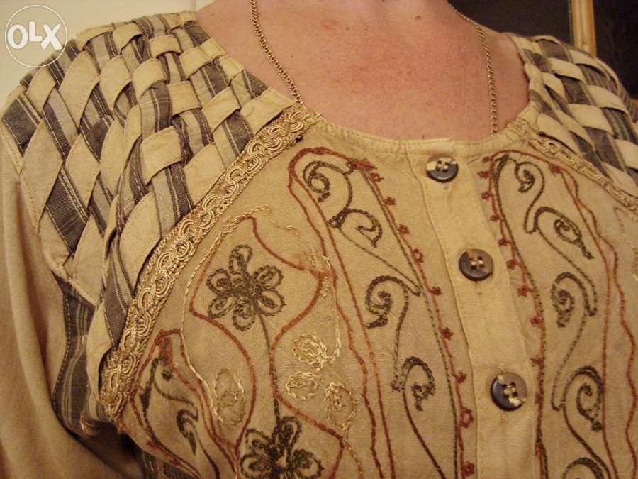 Śliczna sukienka z plecionką na ramionach roz.42 XL