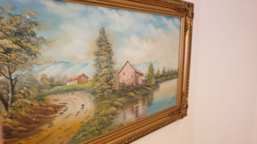 Quadro pintado a óleo com moldura trabalhada dourada