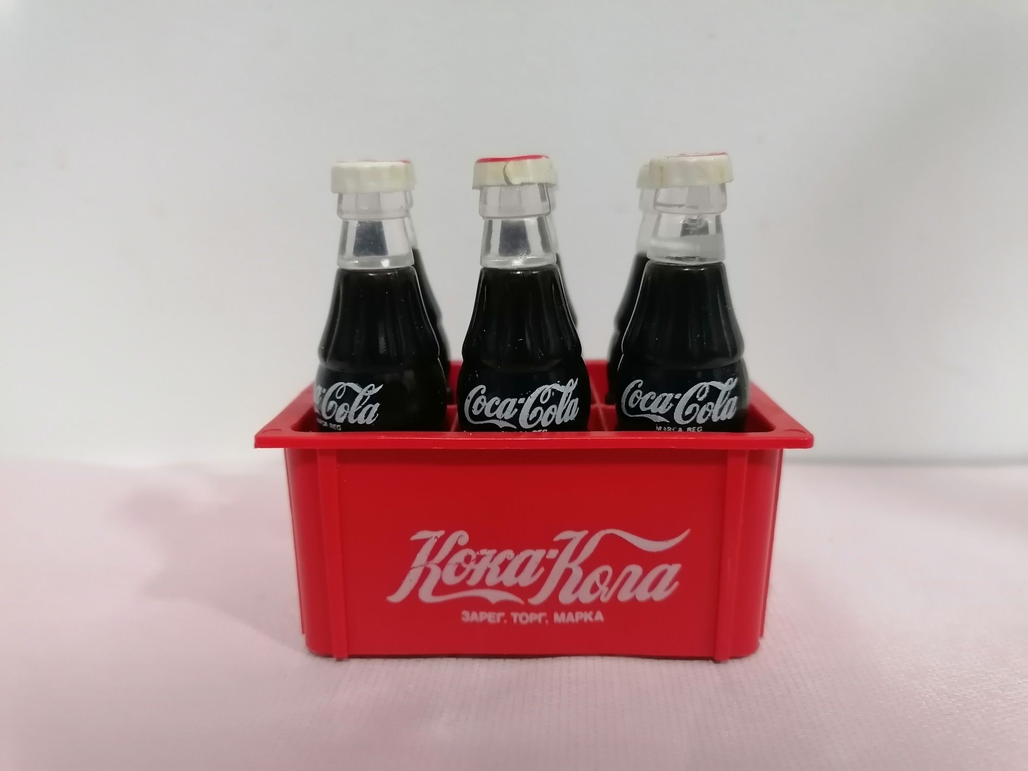 Grade miniatura com 6 garrafinhas em plástico publicidade da Coca-Cola