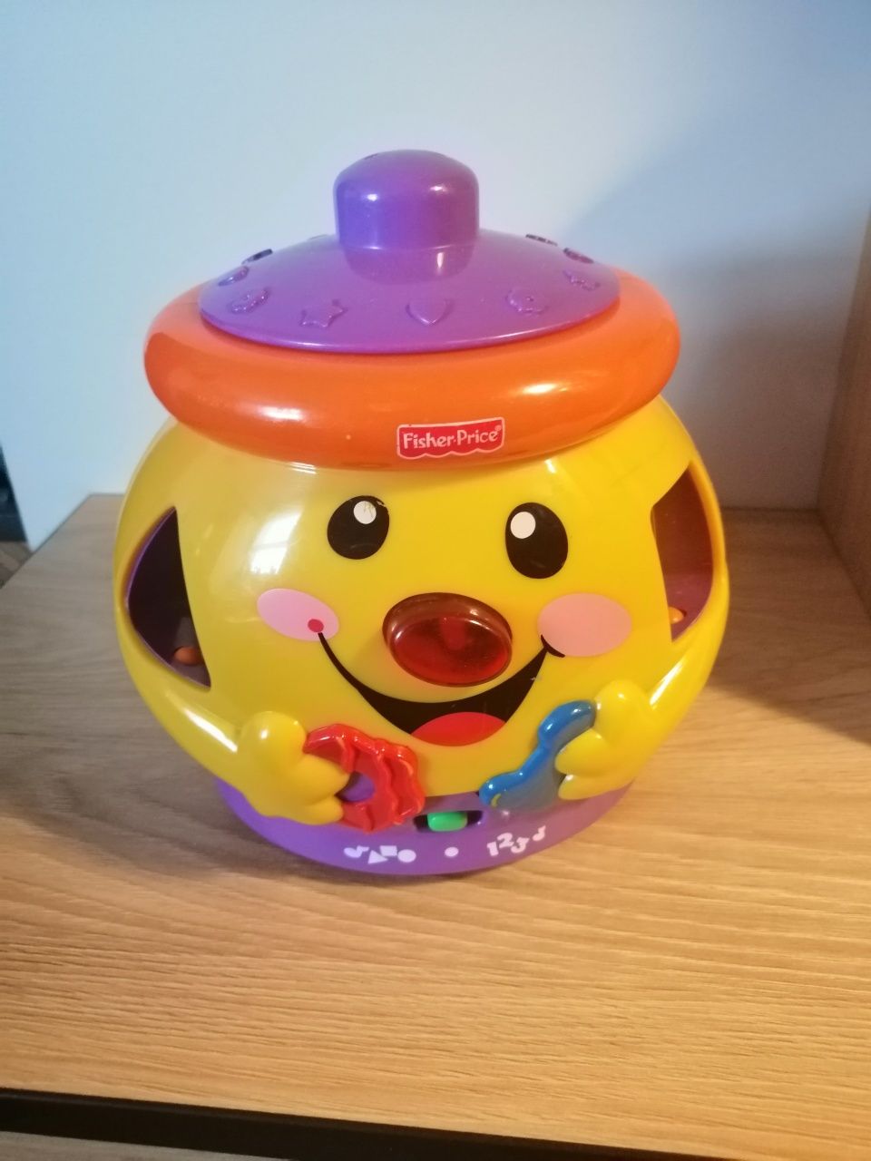 Garnuszek na klocuszek Fisher Price