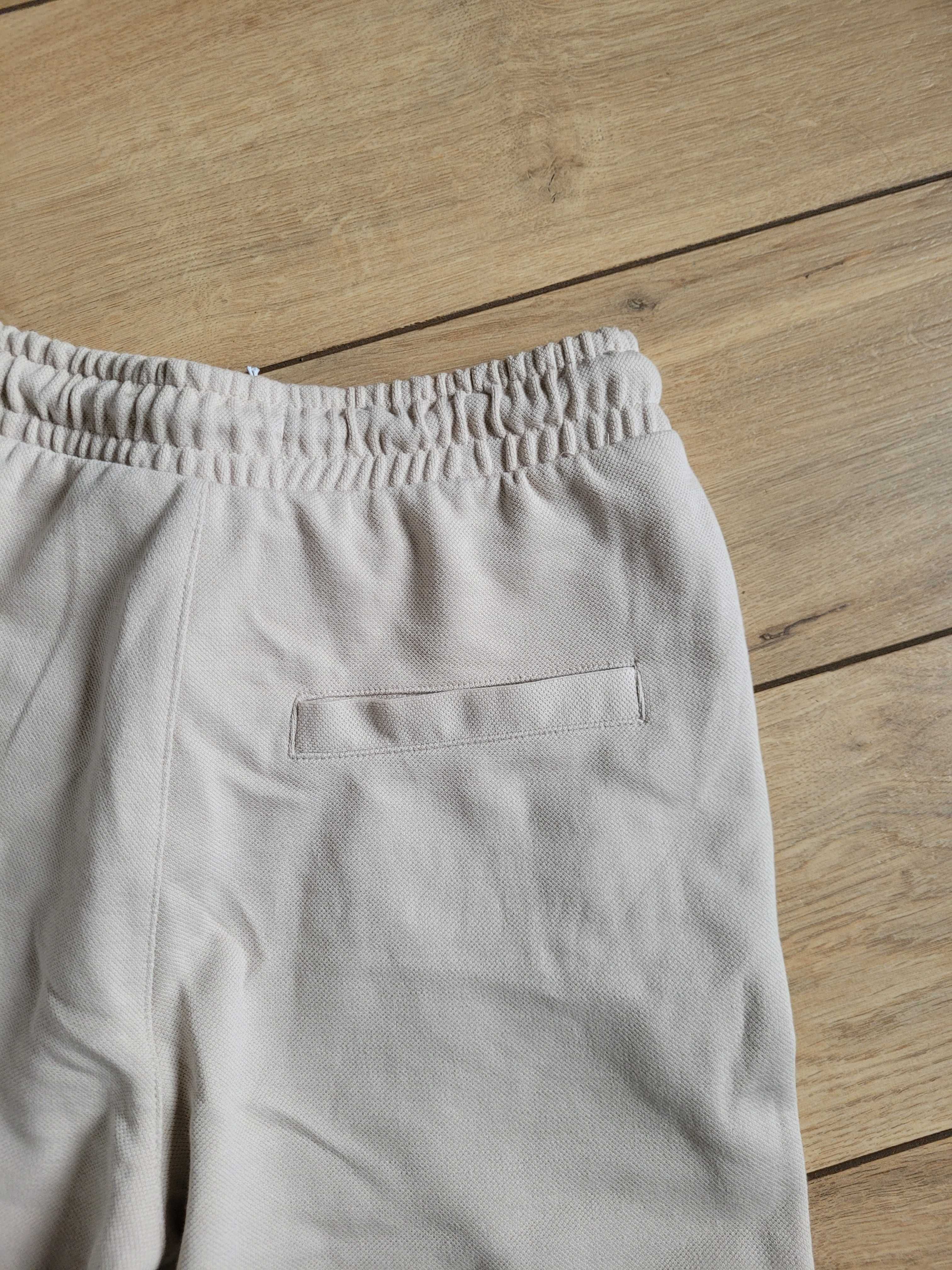 Nowe długie spodnie chłopięce Reserved 134 8 lat chino miękkie