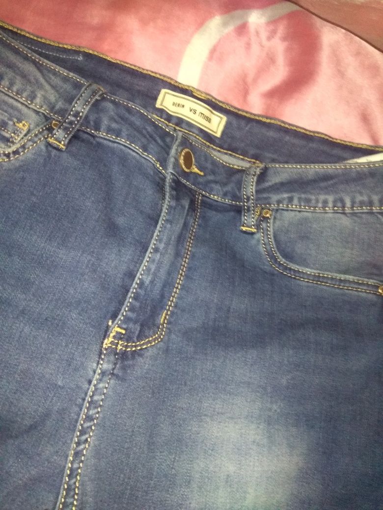NOWE Jeansy dżinsy z elastanem i dziurami rozciągliwe proste rurki M