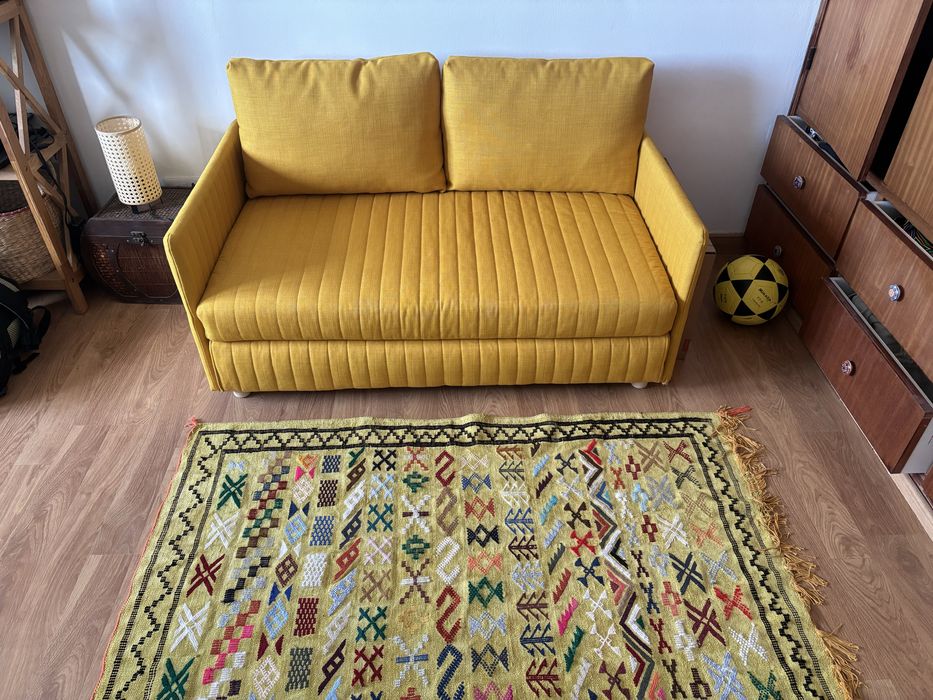 Sofá-cama Skiftebo amarelo