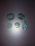 Moedas antigas em escudo