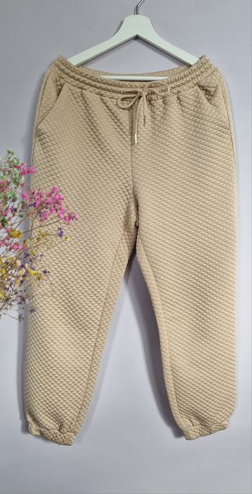 Beżowe pikowane spodnie do kostek chinosy joggery 40 L