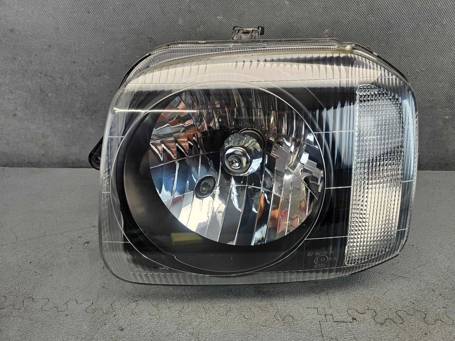 Suzuki Jimny III Lampa Przód Przednia Lewa Oryginał Europa Stan BDB