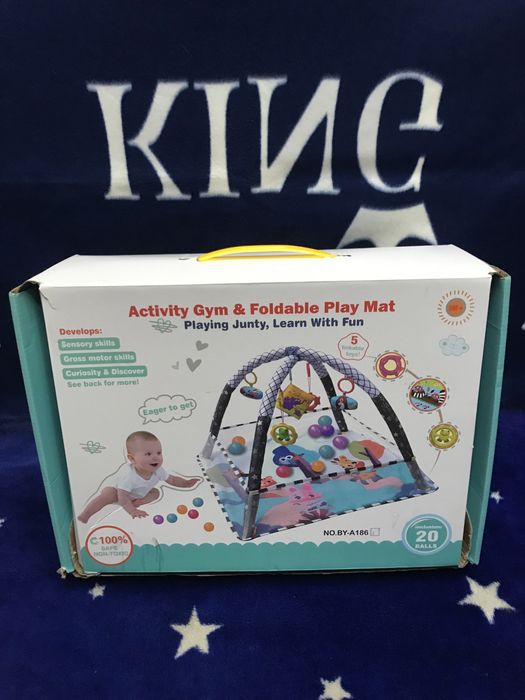 Дитячий розвиваючий килимок-манеж з дугами і кульками