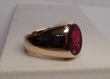 Masywny złoty sygnet purpurowo rubinowy kamień R.23