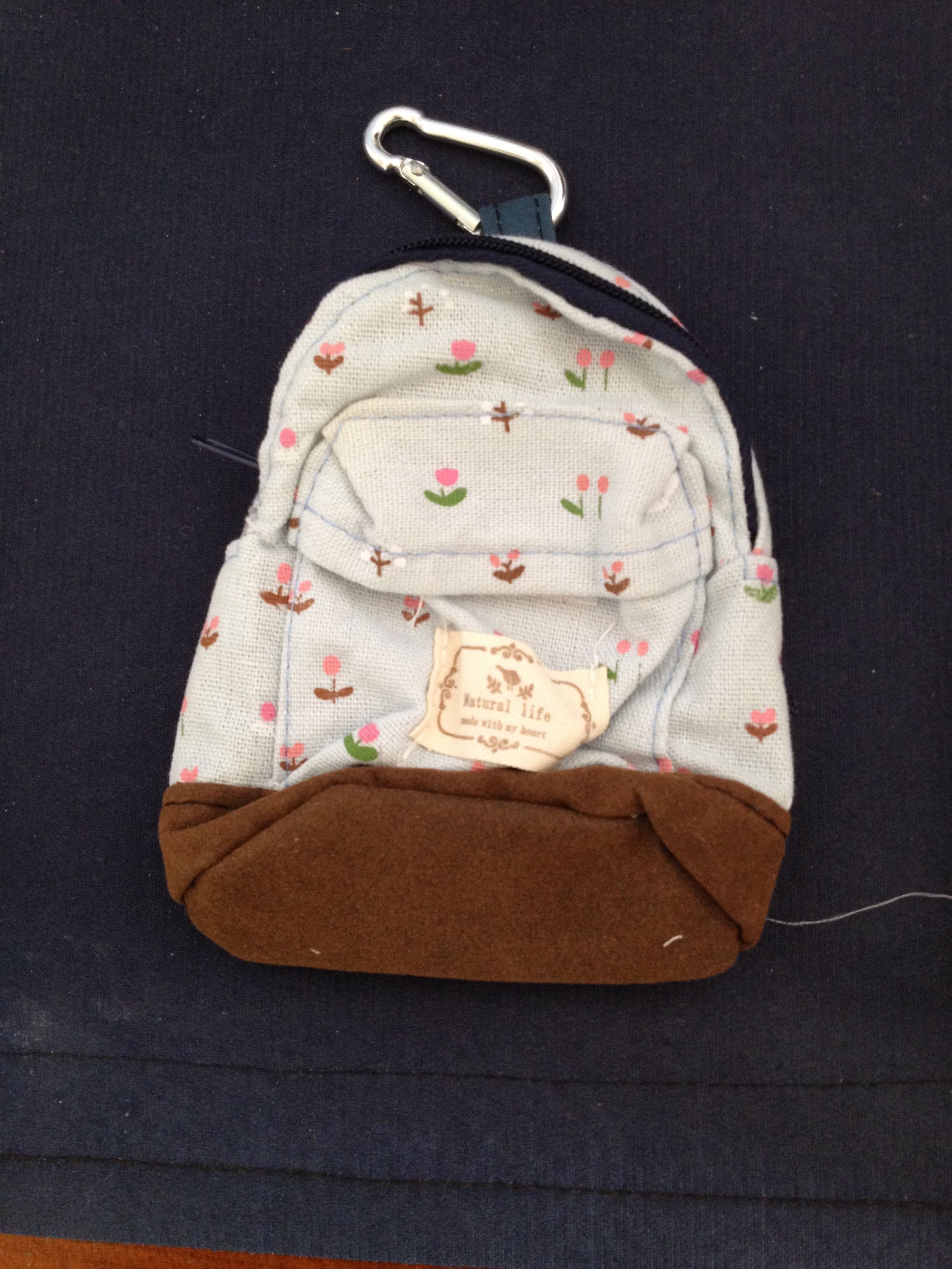 Mini mochila em tecido - 1 cor à escolha