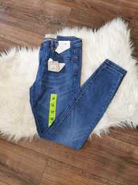 Elastyczne spodnie dżinsowe jeansowe dżinsy jeansy rurki skinny fit L