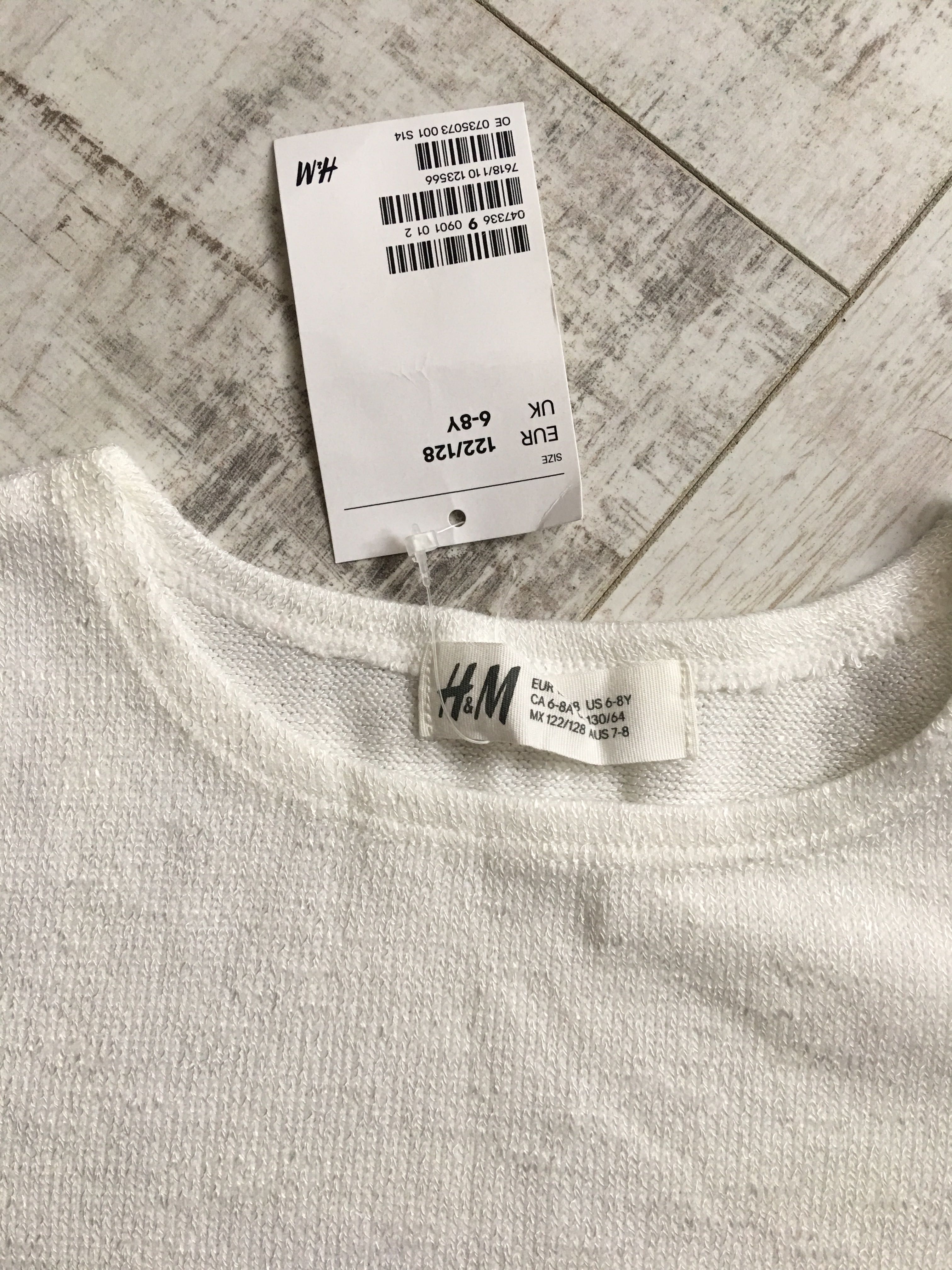 Nowy biały sweterek z koronką H&M dla dziewczynki rozmiar 122-128 cm