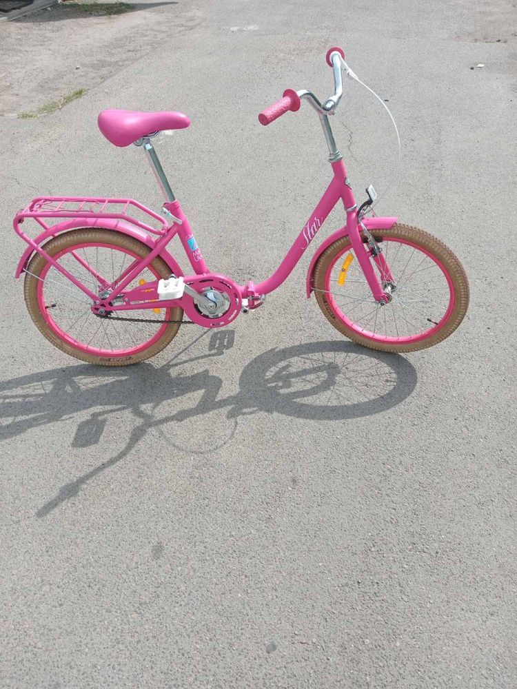 Модный розовый велосипед