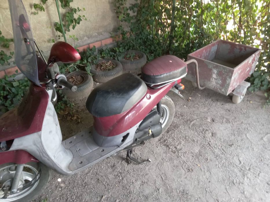 Продам скутер Ноnda  Topik, на ходу. С прицепом