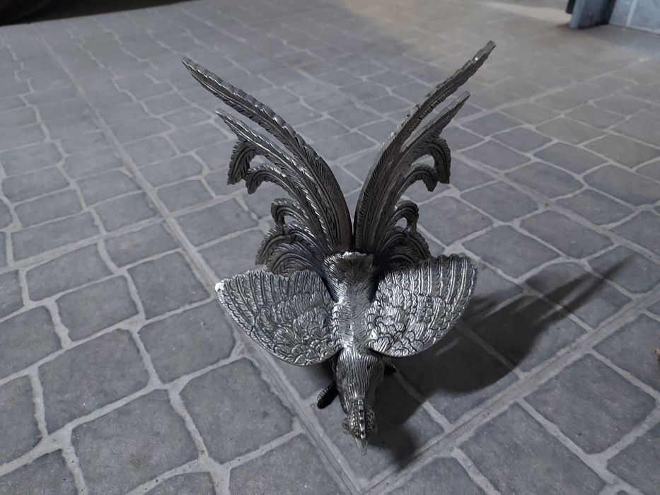 Luta de galos em ferro