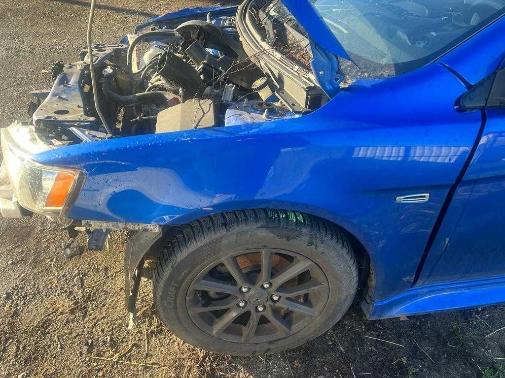 Mitsubishi Lancer VIII części zderzak maska drzwi błotnik D06