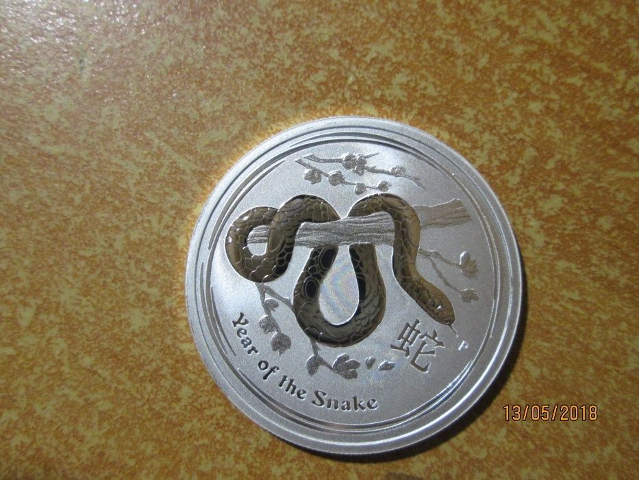 Срібна австралійська монета 50 центів 2013 року