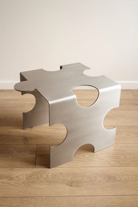 Designerski stolik w kształcie puzzla ze stali nierdzewnej