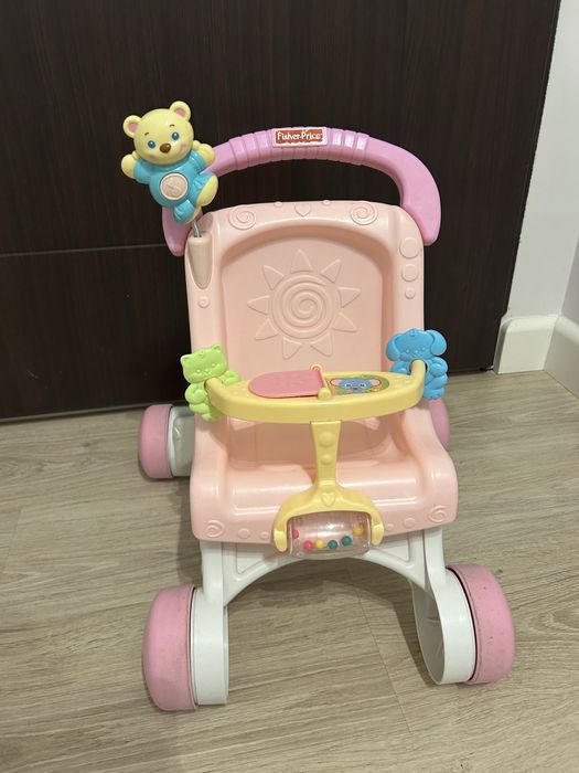 Różowy wózek-pchacz Fisher Price