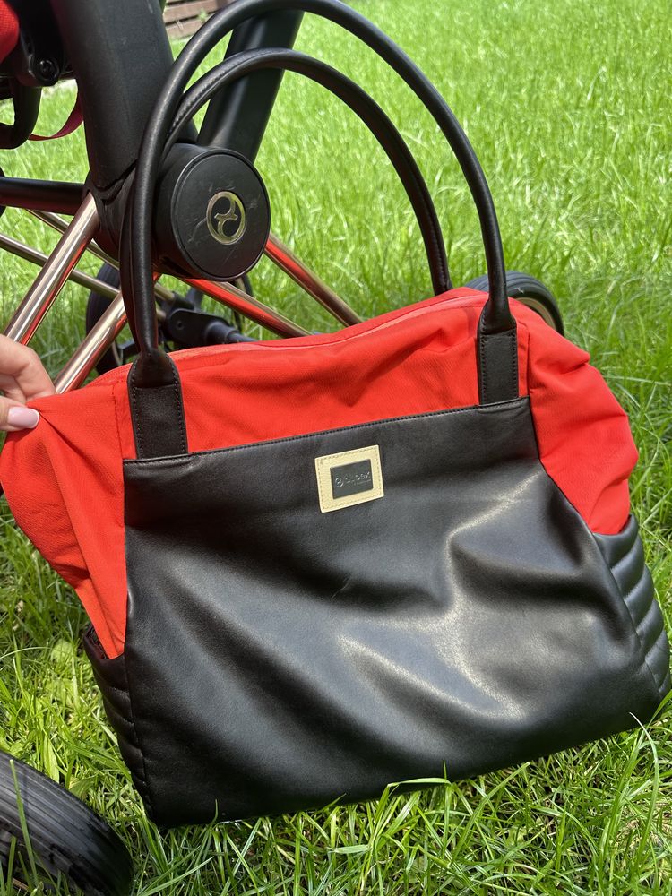 Cybex ярко оранжевая коляска
