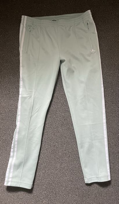 Zielono-miętowe damskie spodnie dresowe Adidas