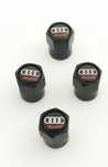 Nowe kapturki na wentyle Audi czarne logo komplet