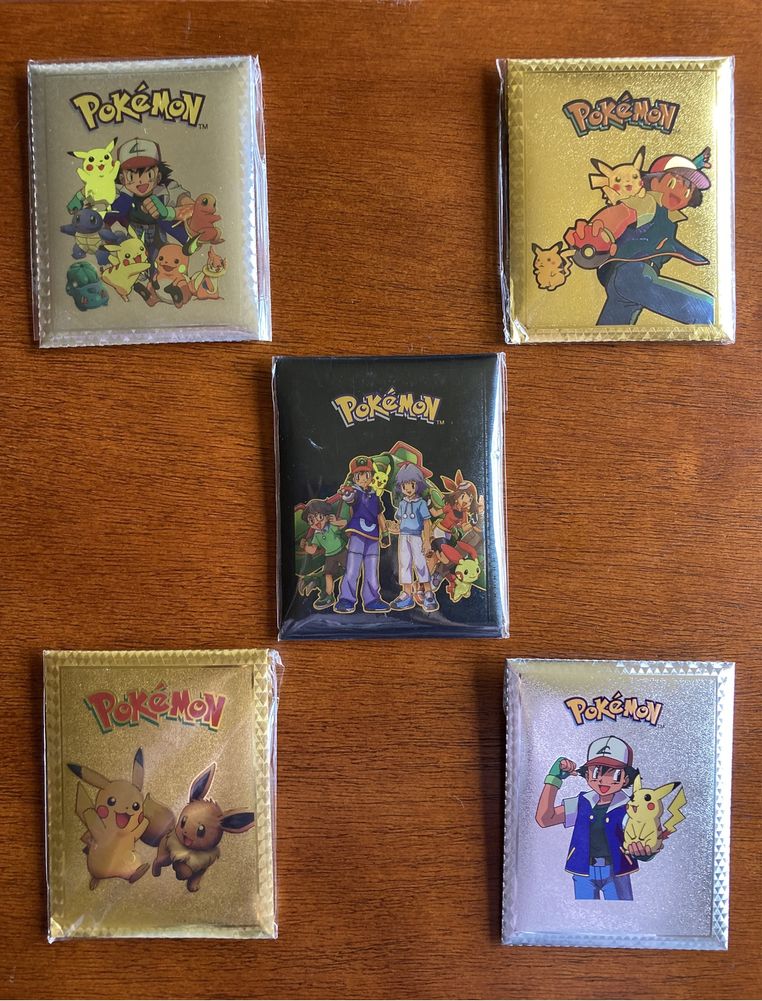 Cartas pokémon douradas prateadas, pretas e coloridas