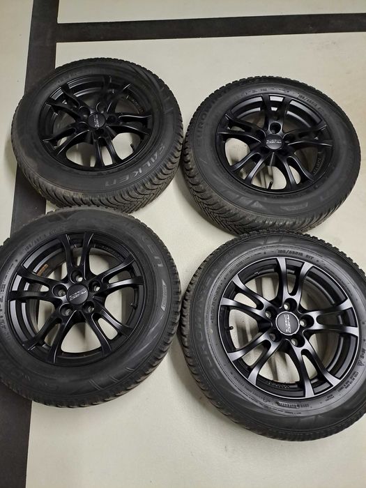 Czarne alufelgi Anzio 5x114.3 i opony zimowe Falken 195/65R15 91T
