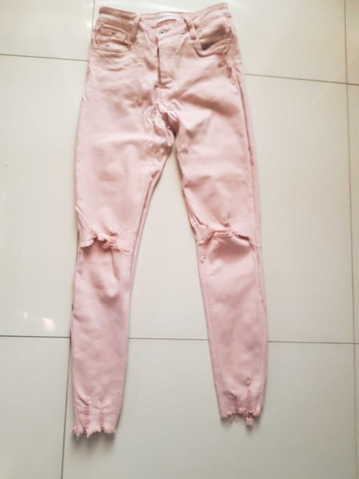 Jeansy dziury pudrowy róż