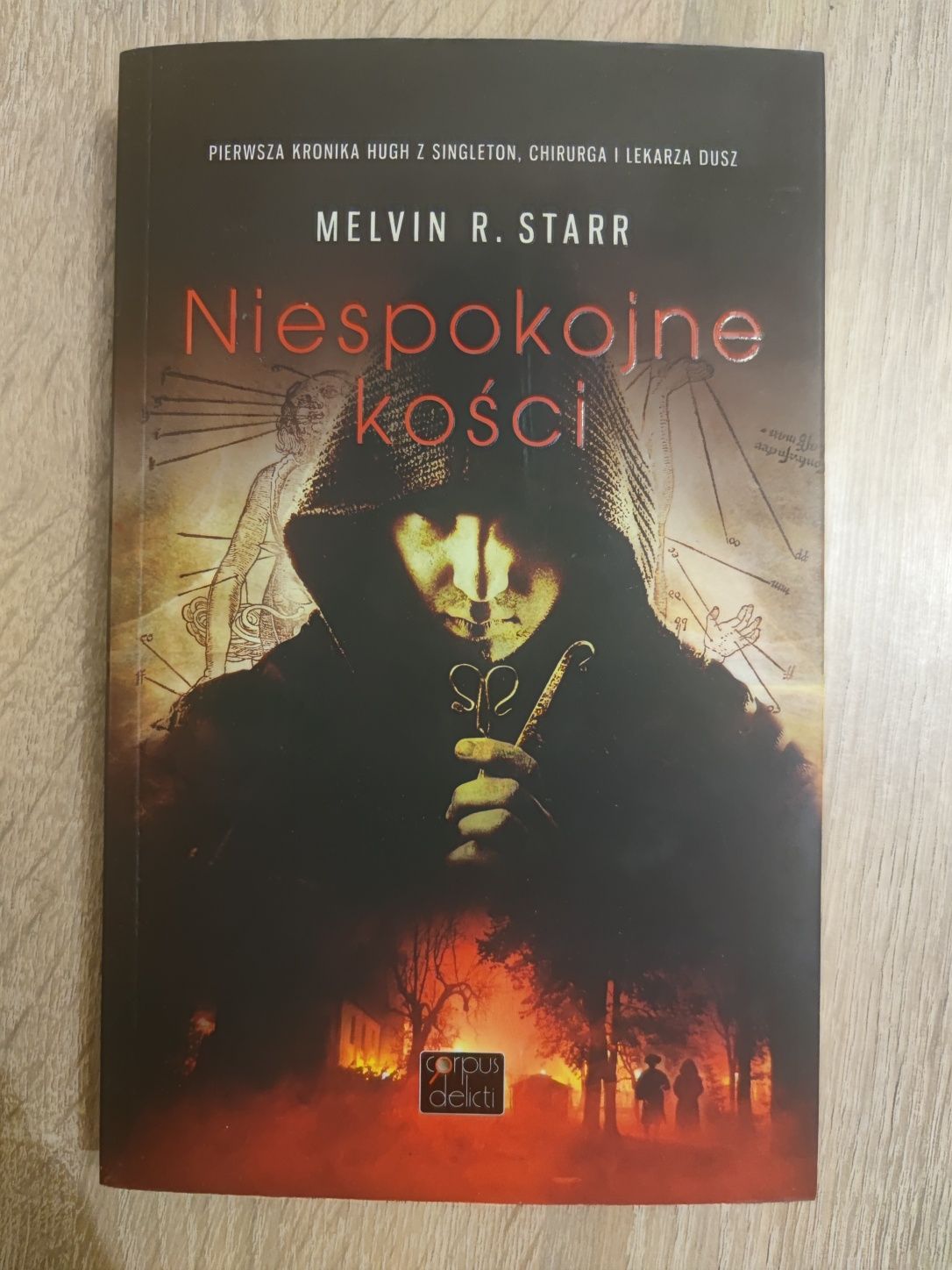 Książka "Niespokojne kości" Melvin R. Starr