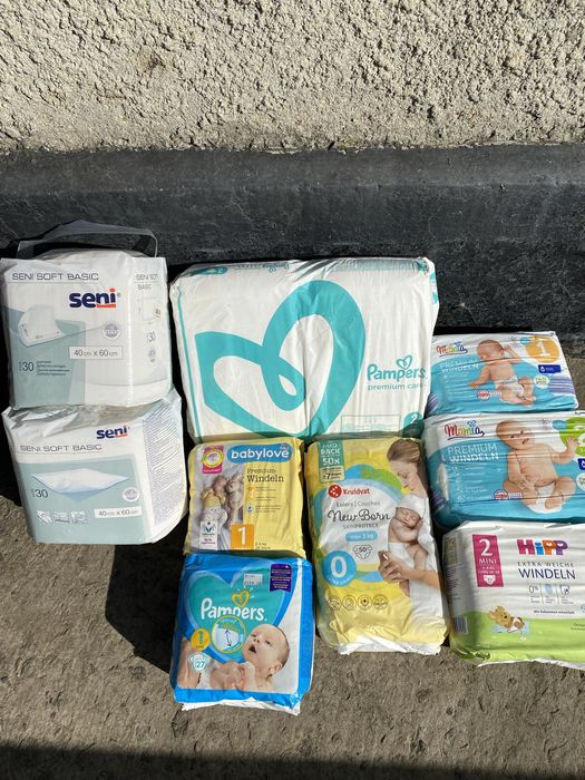 Підгузки дитячі і пеленки одноразові