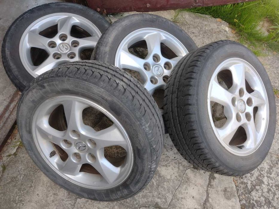 Mazda Felgi 15 cali Alu plus opony letnie 15x6JJ 5x114,3 ET50