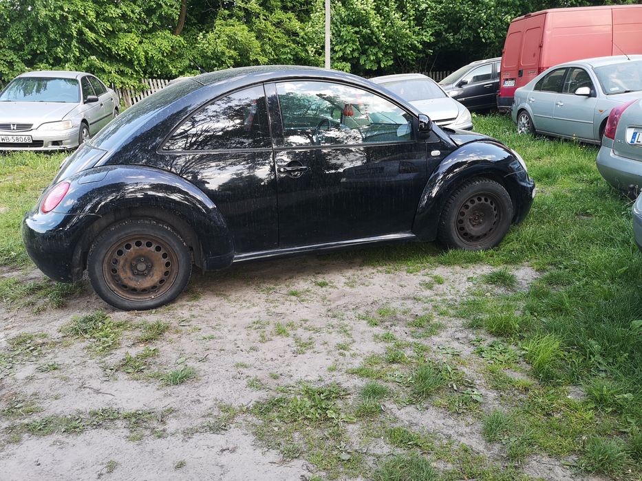VW New Beetle części od a-z mocowanie okular lampy prawy przód  orygin
