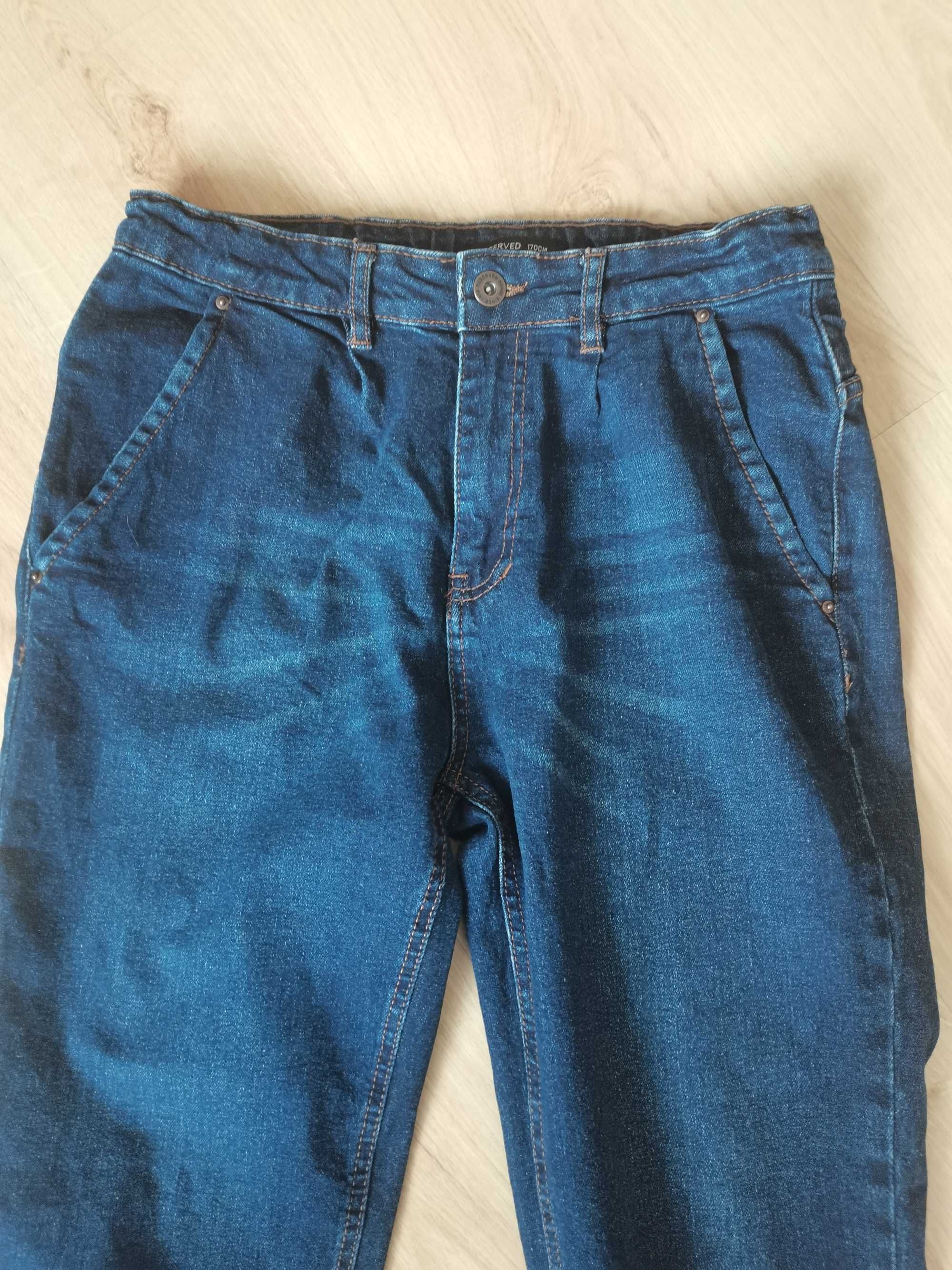 Granatowe jeansy Reserved, rozmiar 170 cm stan bardzo dobry.