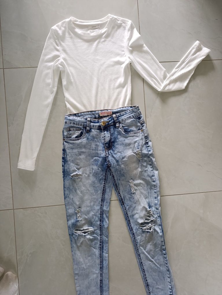 Spodnie jeansy damskie dziury jeans niebieskie błękitne dziury S 36