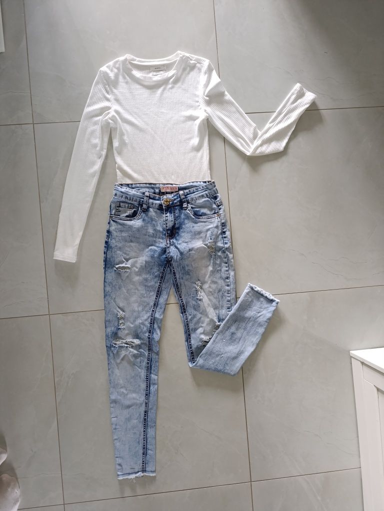 Spodnie jeansy damskie dziury jeans niebieskie błękitne dziury S 36