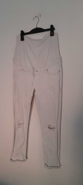 H&M Białe ciążowe jeansy rurki skinny z rozdarciami 42