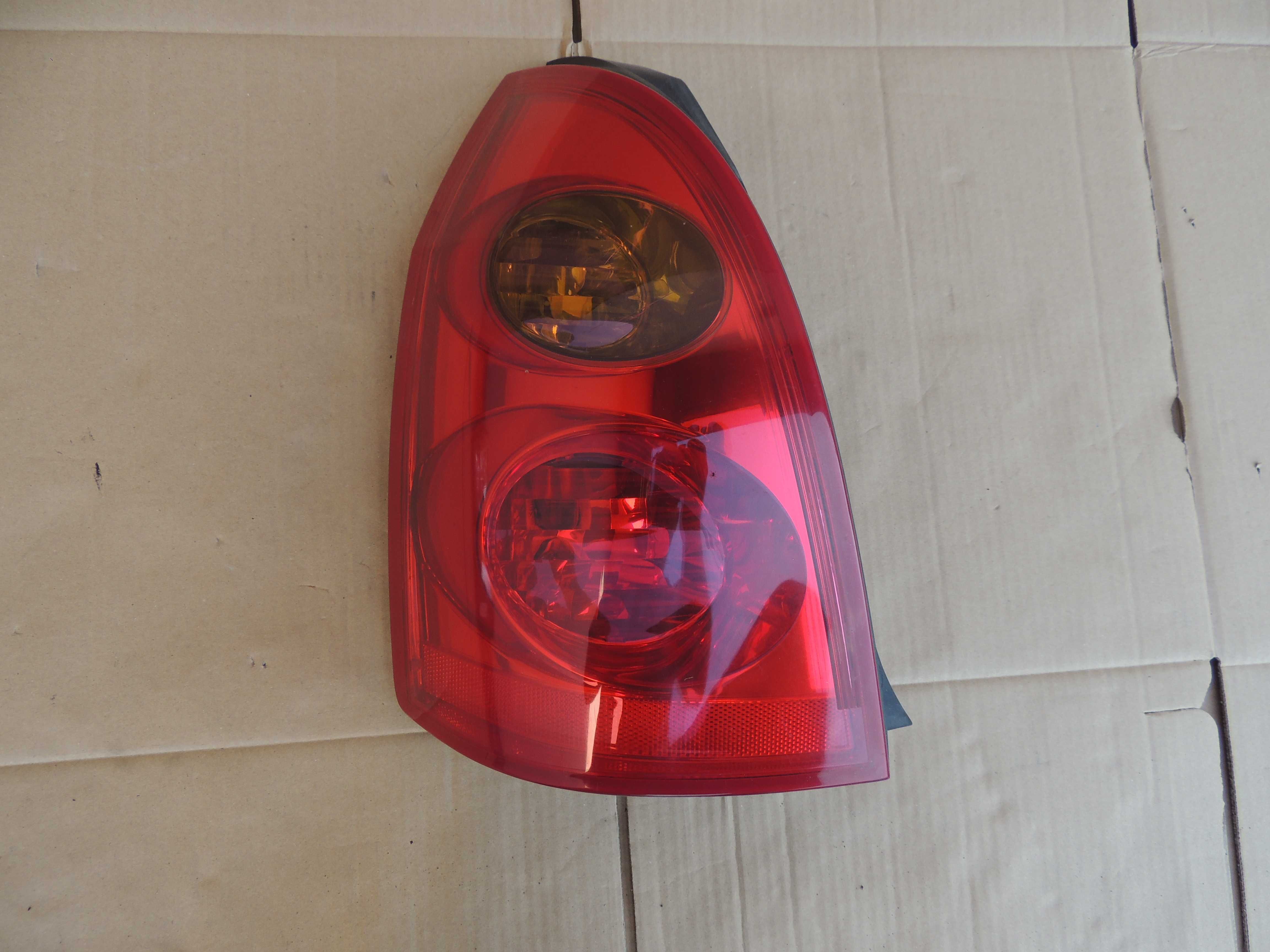 Lampa tył tylna lewa europejska Nissan Primera P12 kombi 02,03,04-07