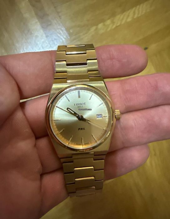 Tissot PRX dourado novo