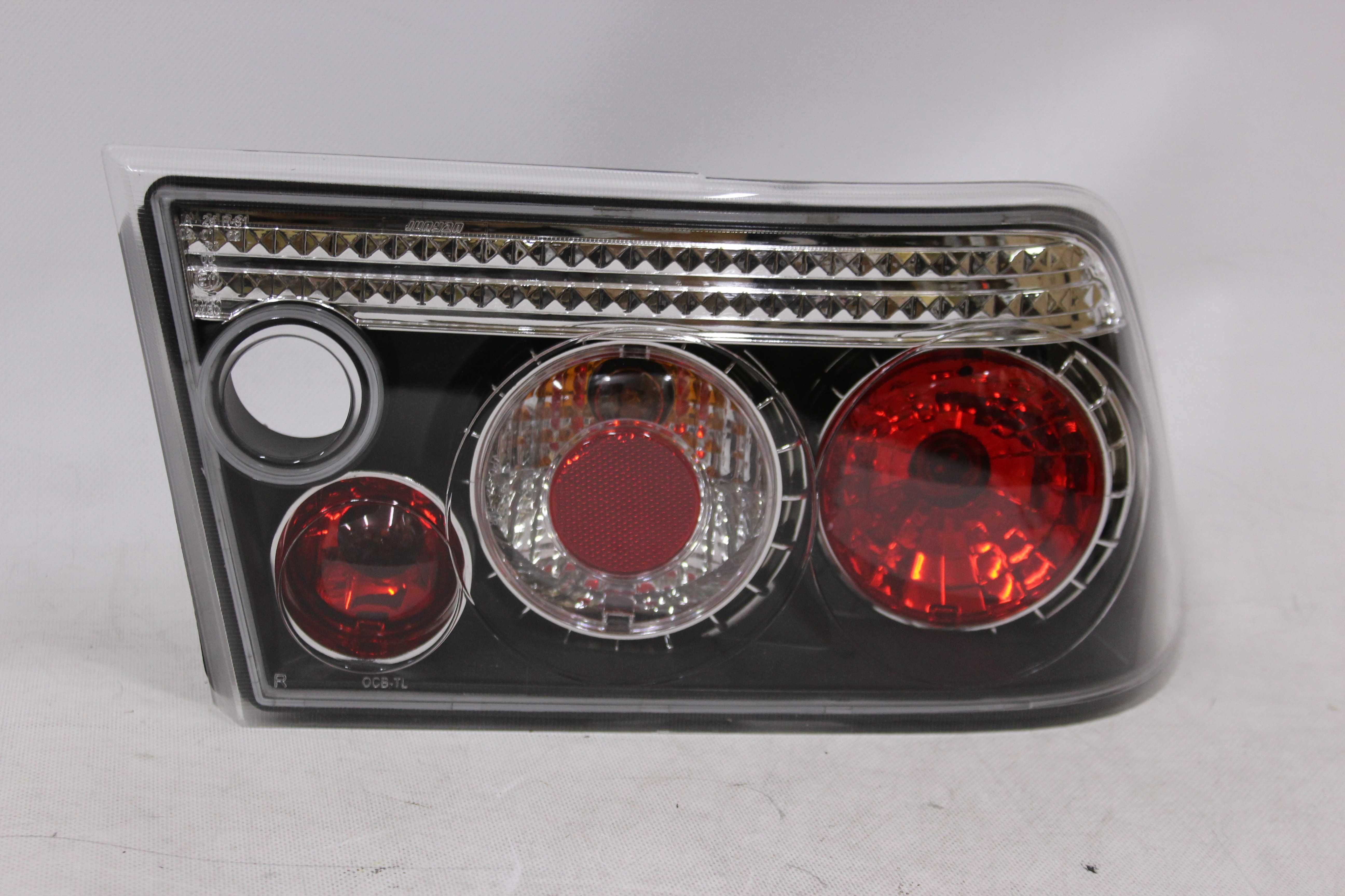 Lampy światła tył tylne OPEL CALIBRA 90-97 BLACK Czarne Smoke NOWE