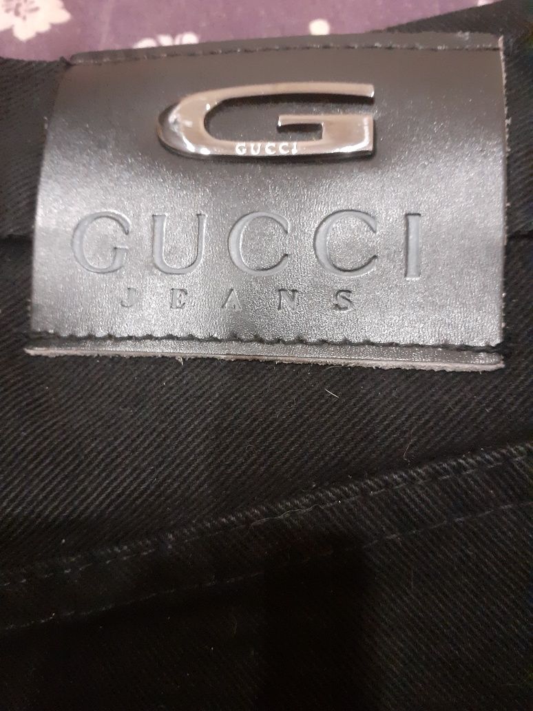 Женские джинсы-брюки фирмы Gucci